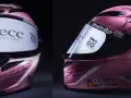Casco rosa da corsa autografato, forse il casco più costoso al mondo, con loghi AECC e Riders.