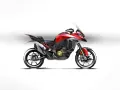 Red Ducati Multistrada V4 motorcycle with a white background.