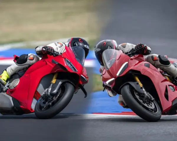 Due superbike Ducati rosse sfrecciano in pista, piegando in curva con maestria.