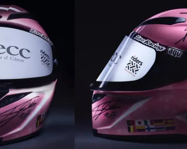 Casco rosa da corsa autografato, forse il casco più costoso al mondo, con loghi AECC e Riders.