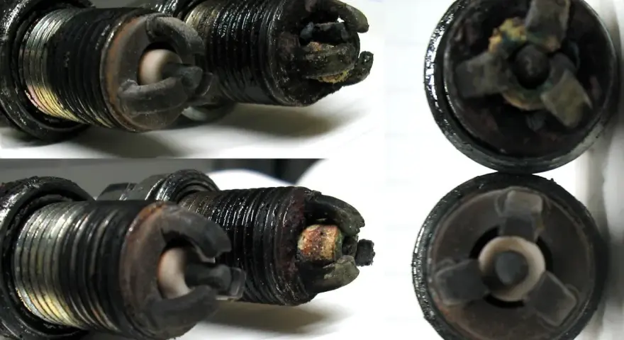 Candele auto sporche e usurate, con depositi carboniosi evidenti. Questi sono chiari sintomi candele da cambiare per un motore efficiente.