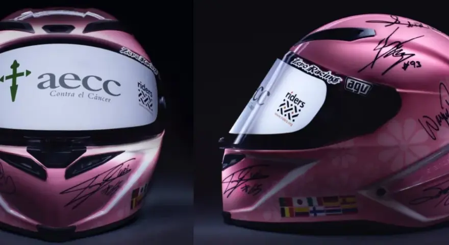 Casco rosa da corsa autografato, forse il casco più costoso al mondo, con loghi AECC e Riders.