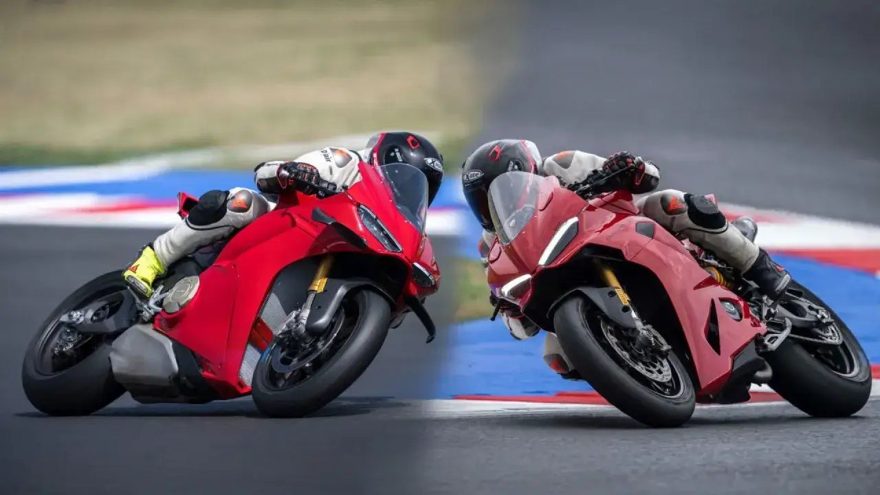 Due superbike Ducati rosse sfrecciano in pista, piegando in curva con maestria.